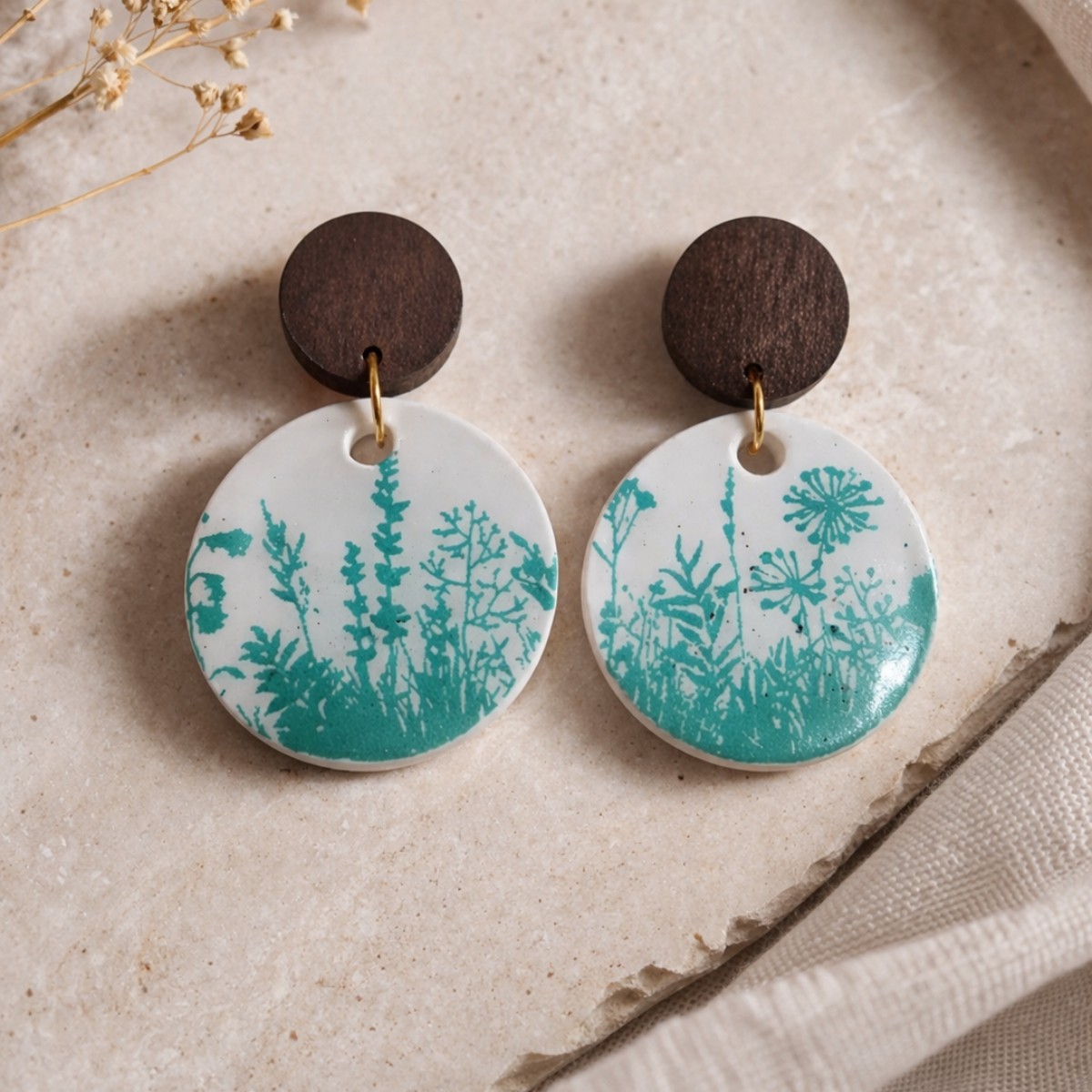 White earrings with green leafy print