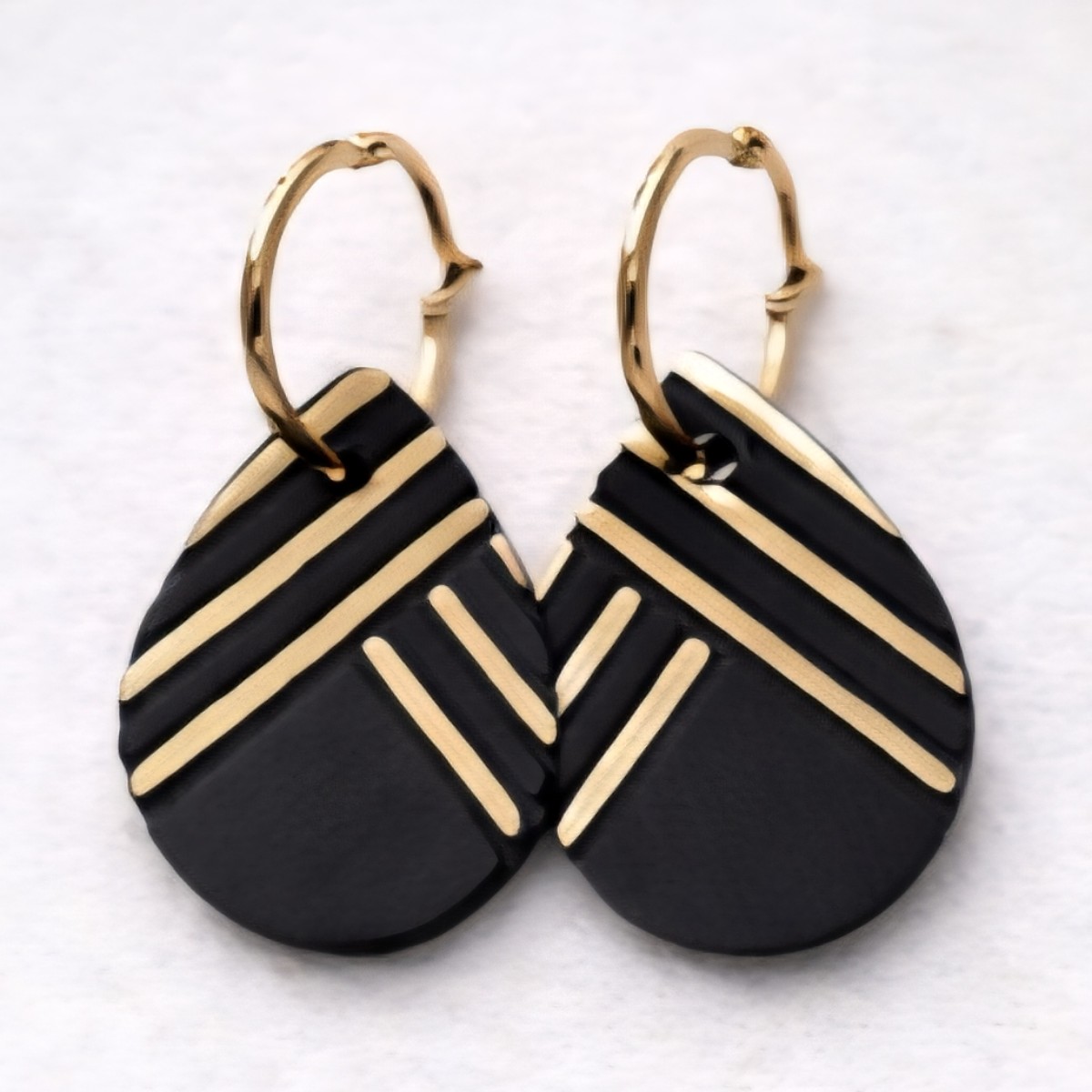 Black and gold teardrop dangles
