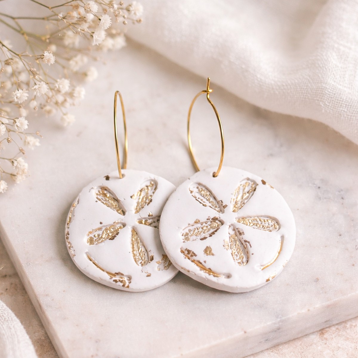 Sand dollar with gold accents