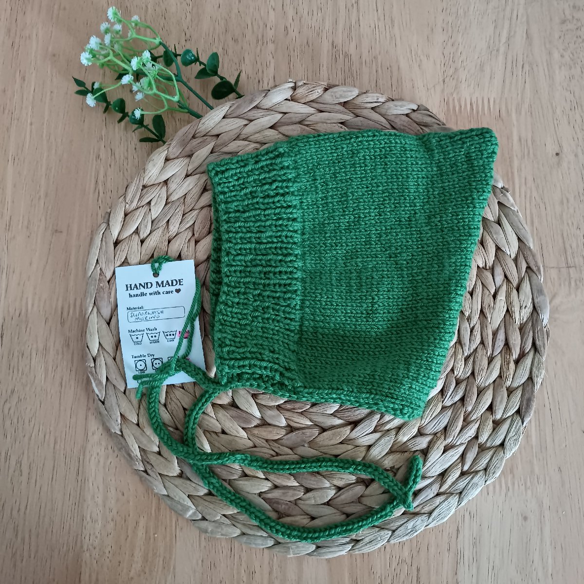 Hand-knitted Baby Hat With Ties