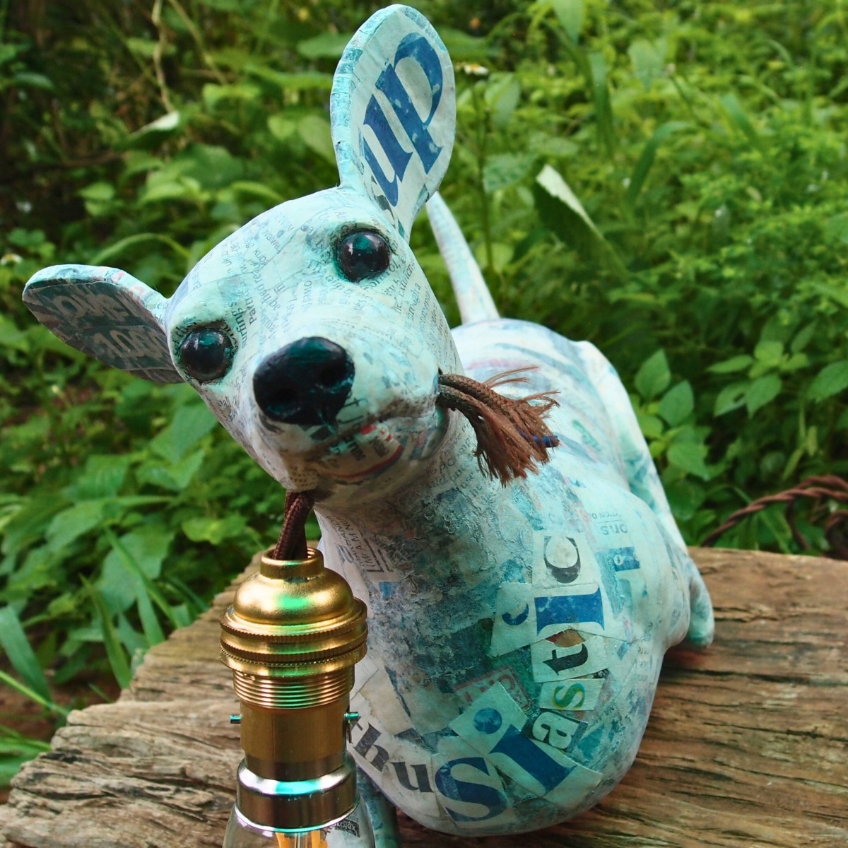 Dingani: Sculpted, upcycled dachshund lamp with relevant newspaper headlines