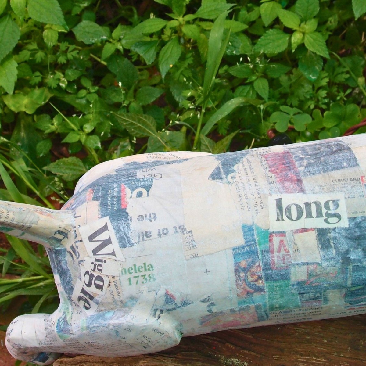 Dingani: Sculpted, upcycled dachshund lamp with relevant newspaper headlines image 2