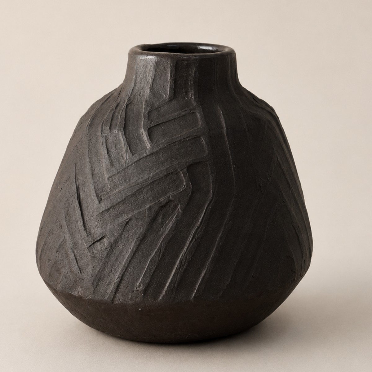Carved black clay vase